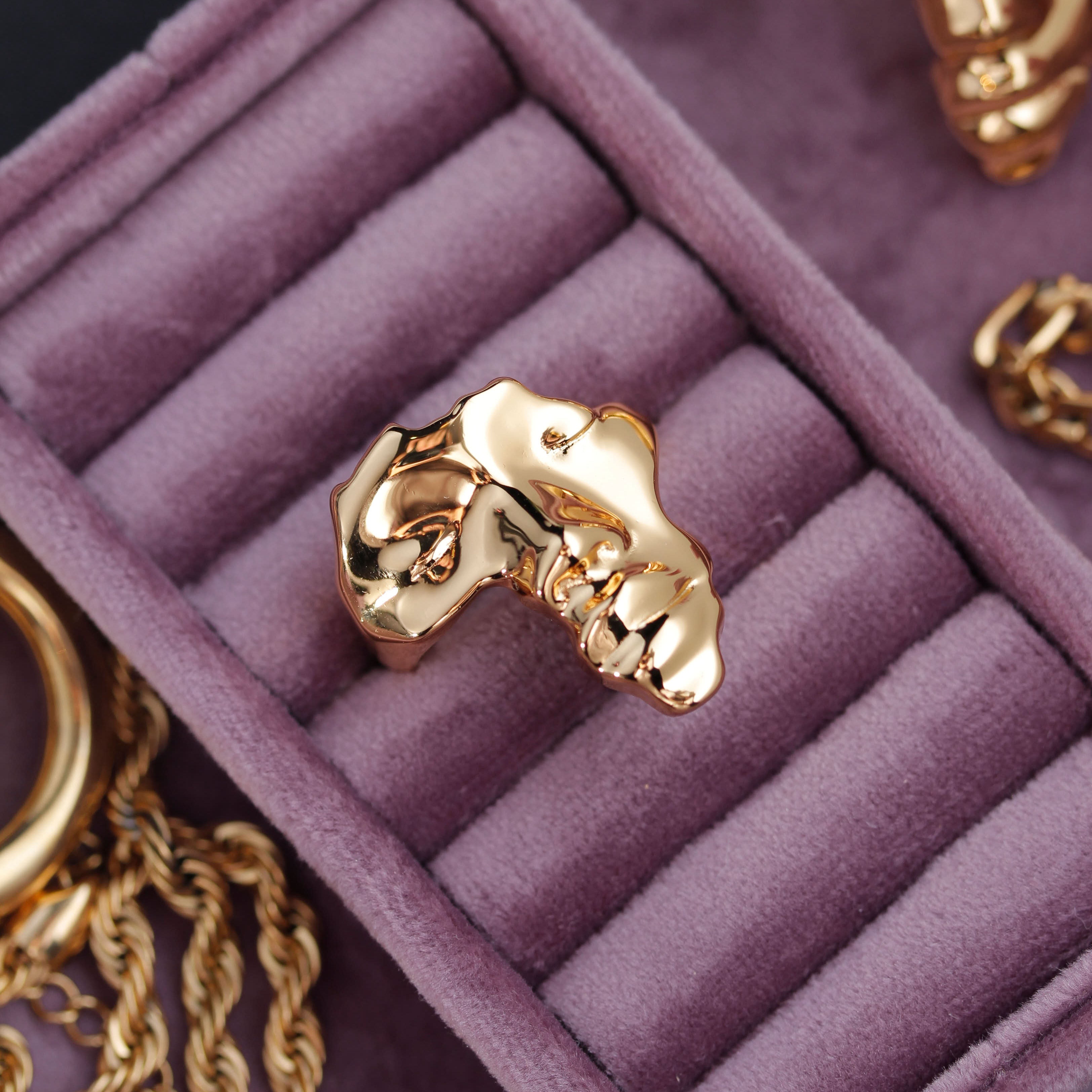 Gold Plated Africa Face Motherland Statement Ring from NUJUAL, a black owned jewelry shop for men and women.