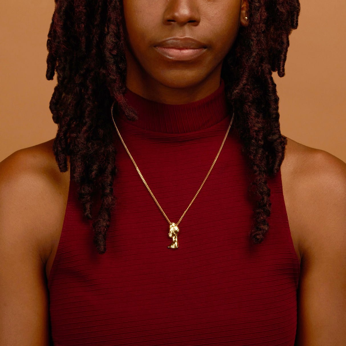 Gold Plated Headwrap Pendant Necklace with Afro Pick from NUJUAL, a black owned jewelry shop for men and women.