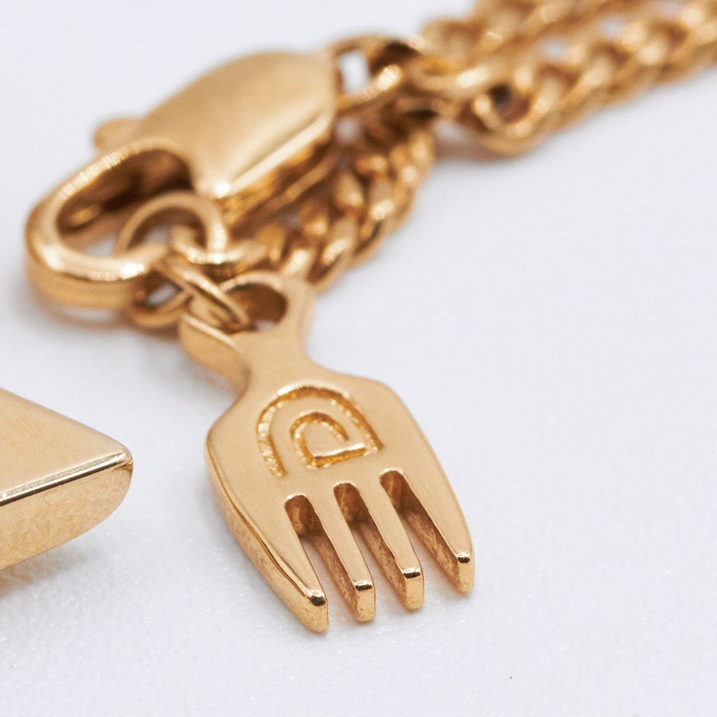 Gold Plated Afro Pendant Necklace with Afro Pick from NUJUAL, a black owned jewelry shop for men and women.