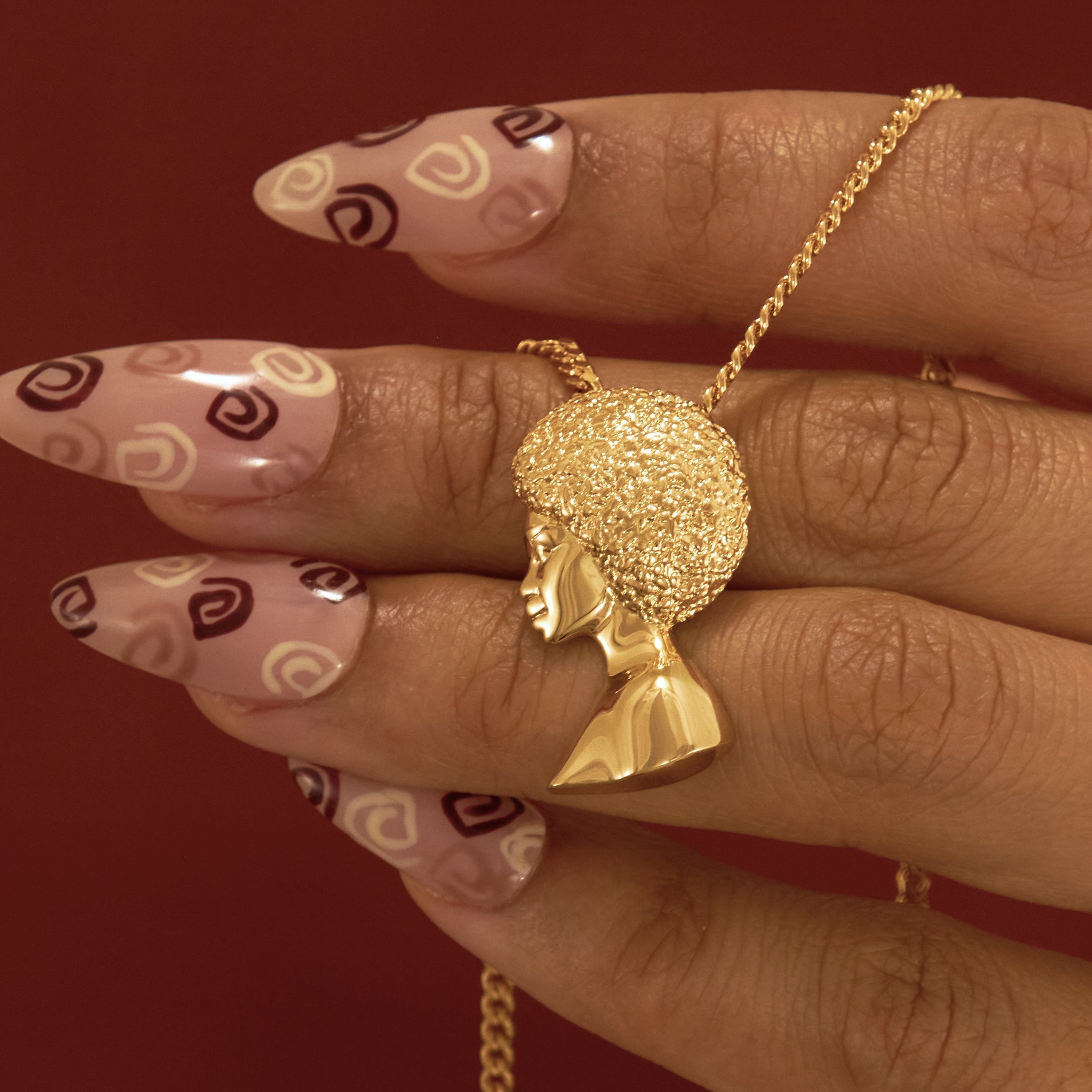 Gold Plated Afro Pendant Necklace with Afro Pick from NUJUAL, a black owned jewelry shop for men and women.