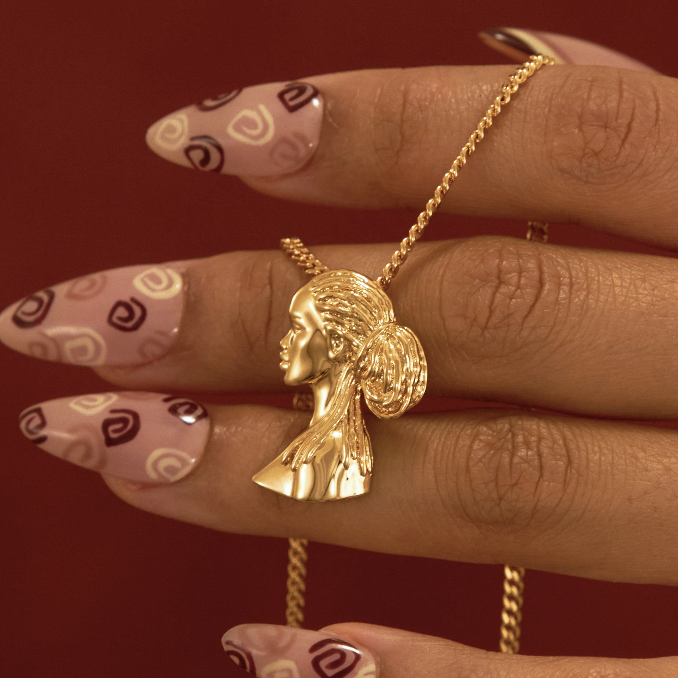 Gold Plated Dreadlocks Pendant Necklace with Afro Pick from NUJUAL, a black owned jewelry shop for men and women.