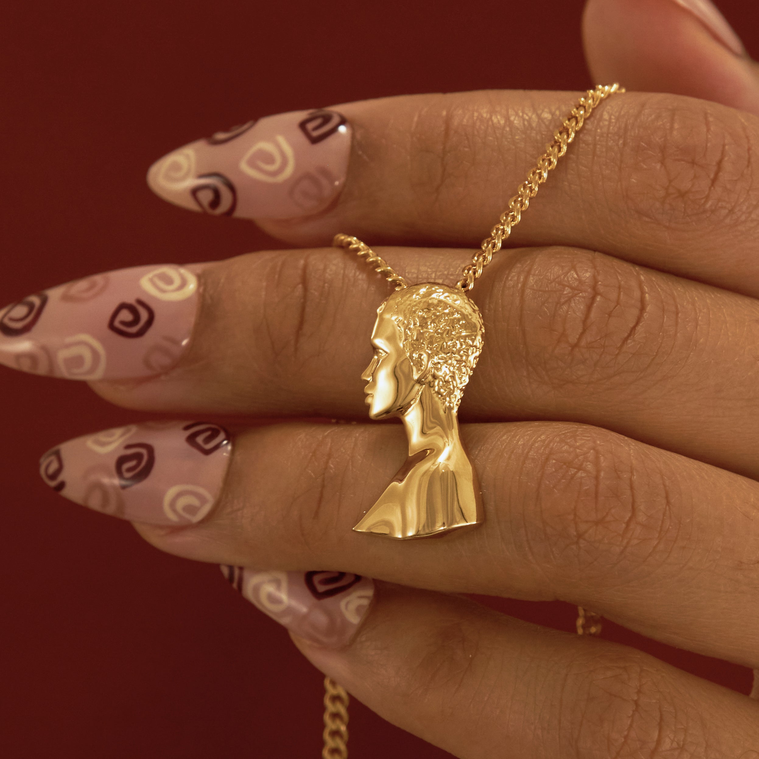 Gold Plated Short Hair Pendant Necklace with Afro Pick from NUJUAL, a black owned jewelry shop for men and women.