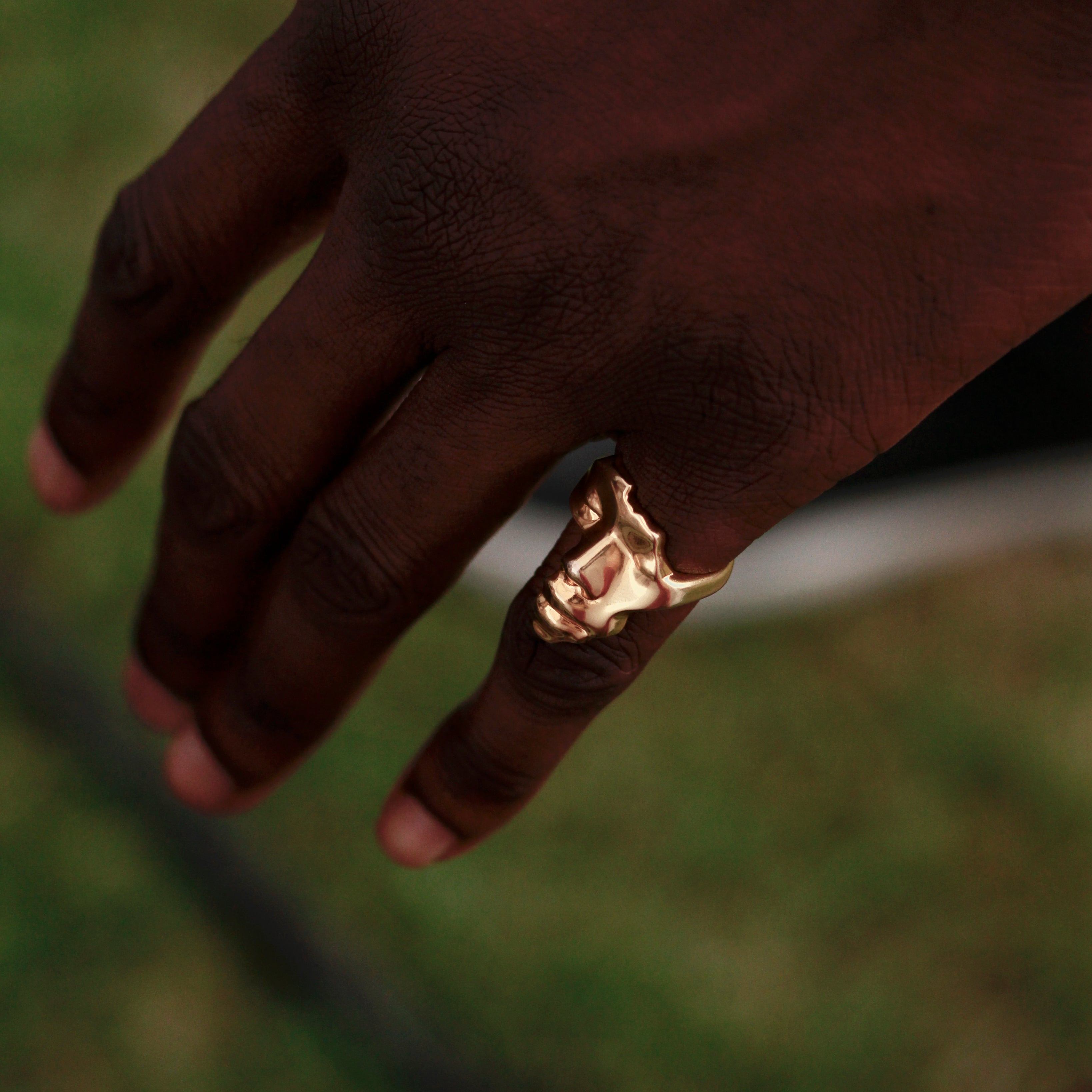 Gold Plated Africa Face Motherland Statement Ring from NUJUAL, a black owned jewelry shop for men and women.