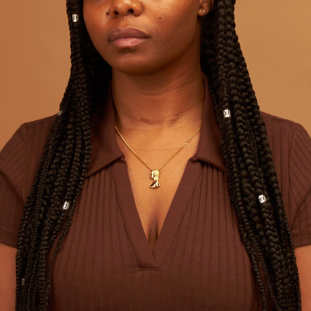Gold Plated Twists/Braids/Cornrows Hair Pendant Necklace with Afro Pick from NUJUAL, a black owned jewelry shop for men and women.
