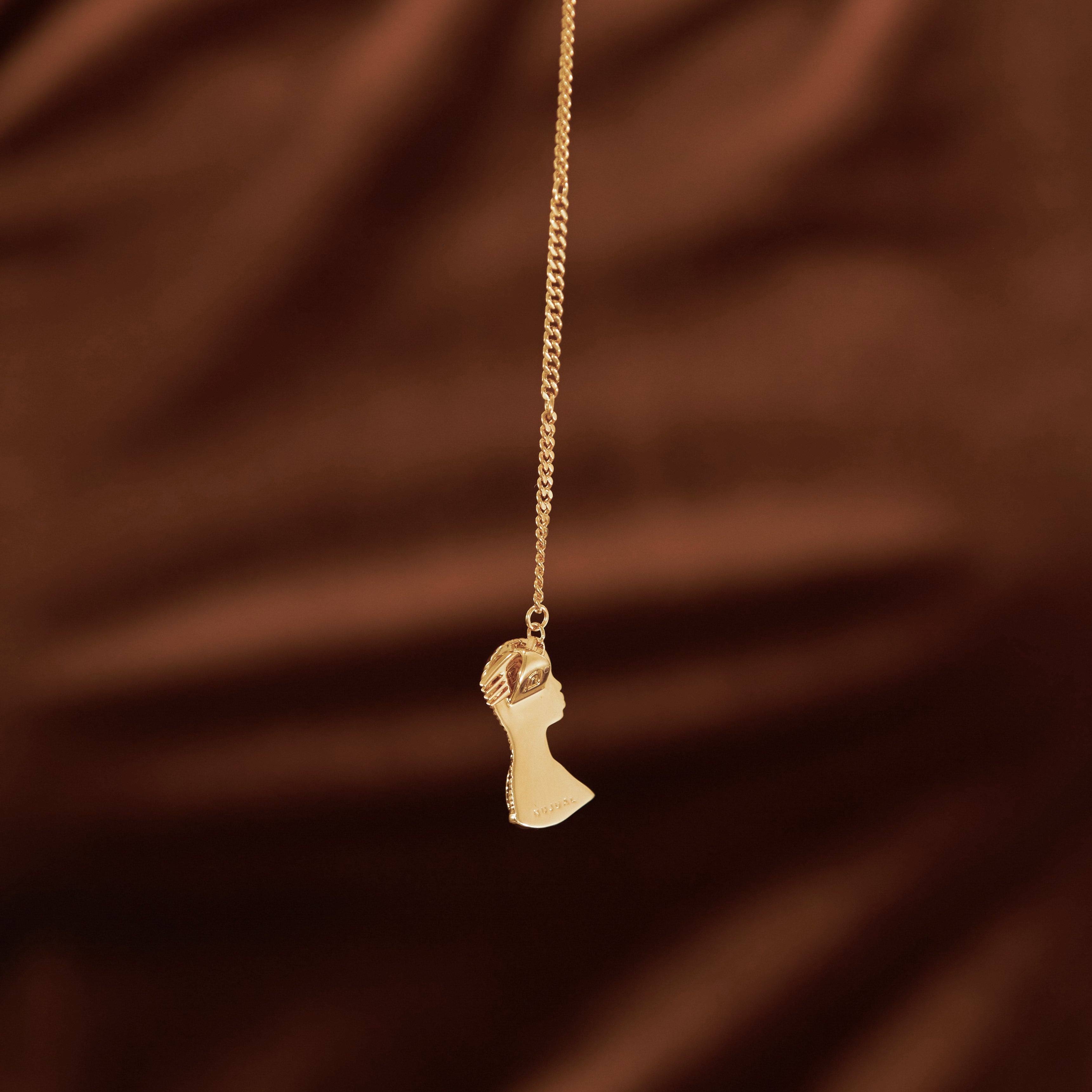 Gold Plated Twists/Braids/Cornrows Hair Pendant Necklace with Afro Pick from NUJUAL, a black owned jewelry shop for men and women.